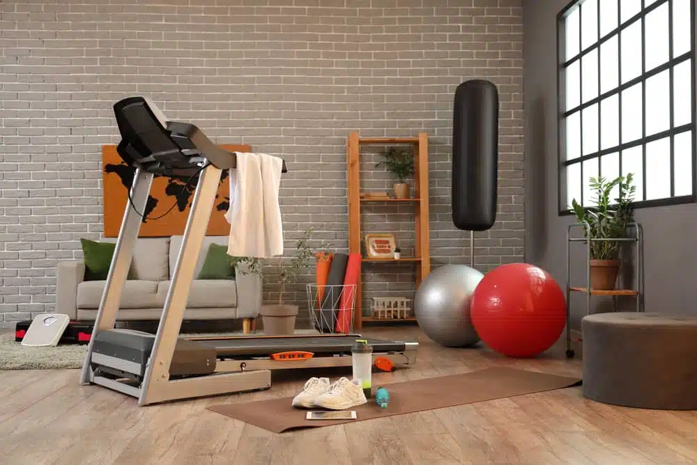 A modern home gym setup with equipment, ideal for testing the best home gym speakers
