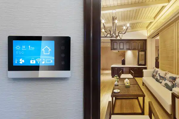 Smart Home Panel Smart wall panel controls lights and climate, showcasing home automation installation services in modern livingroom
