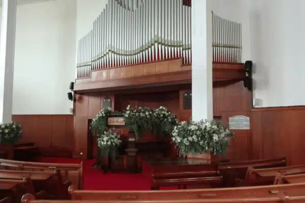 Sanctuary view with organ pipes and floral decor for Church sound system installation and setup